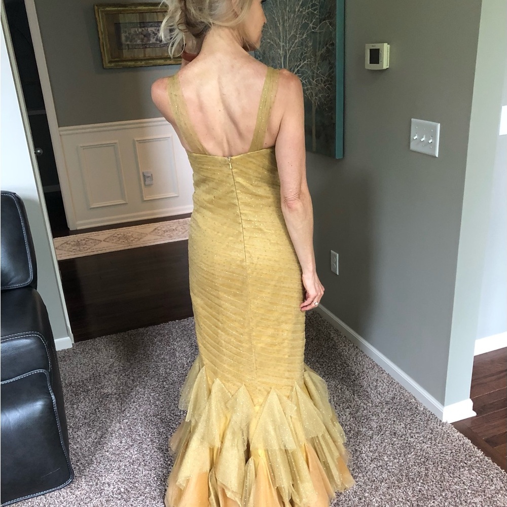 Gold strapless mermaid-style formal gown with a ruffled tulle skirting - Picture 3 of 11